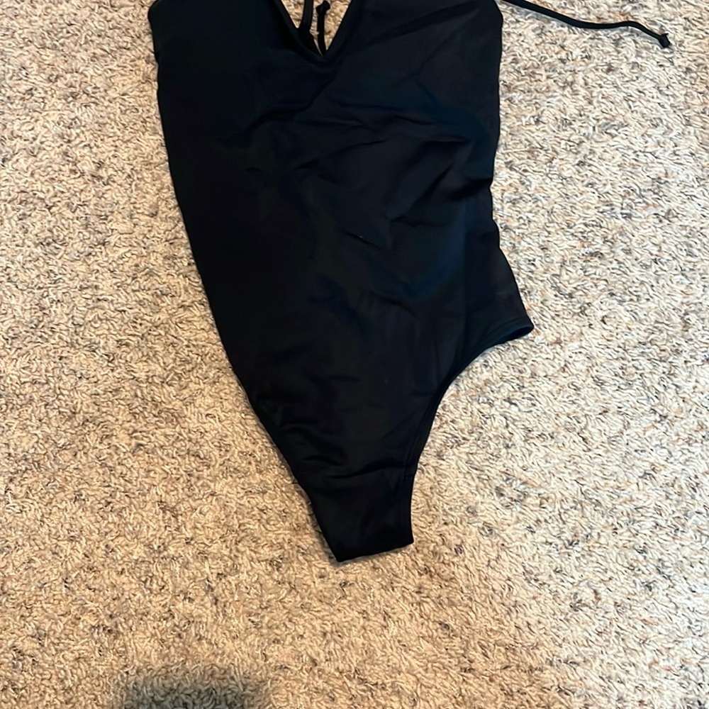 TA3 plungey one piece bathing suit, size medium. Designed for shape shifting